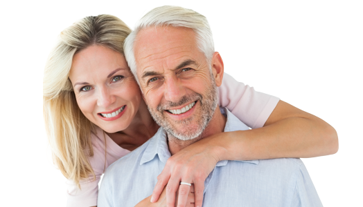 middle aged couple with dental implants smiling
